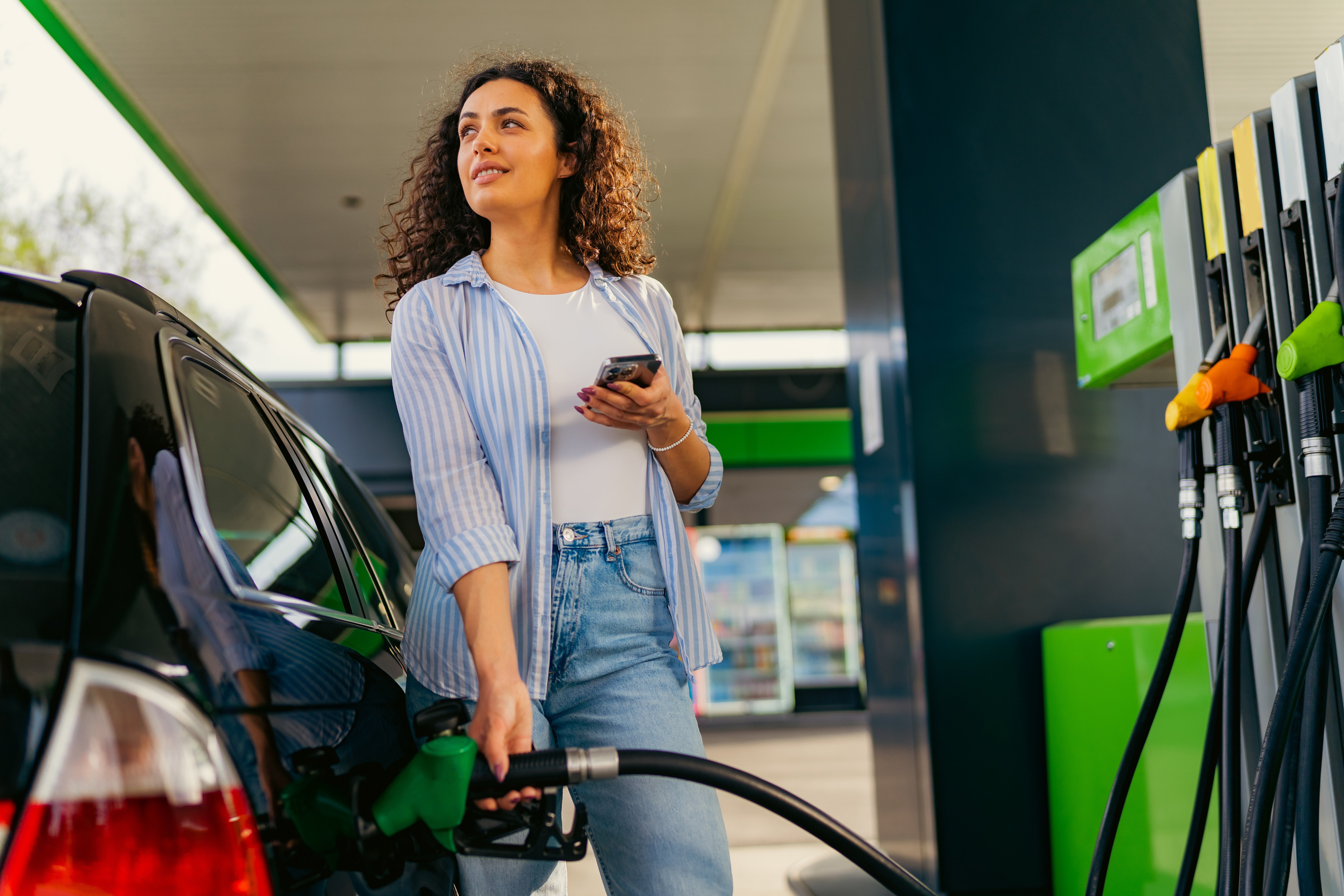 woman at gas pump